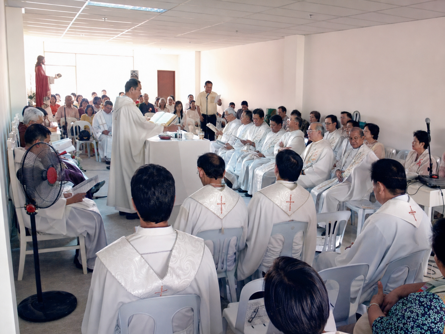 Members of the Sacred Heart family and guests gather inside the newly opened clinic reception area after the blessing.