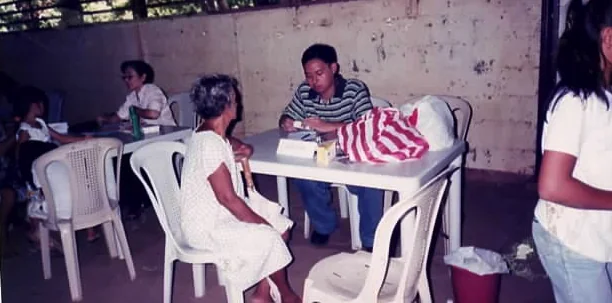 Patient consultation during a Sacred Heart community medical mission