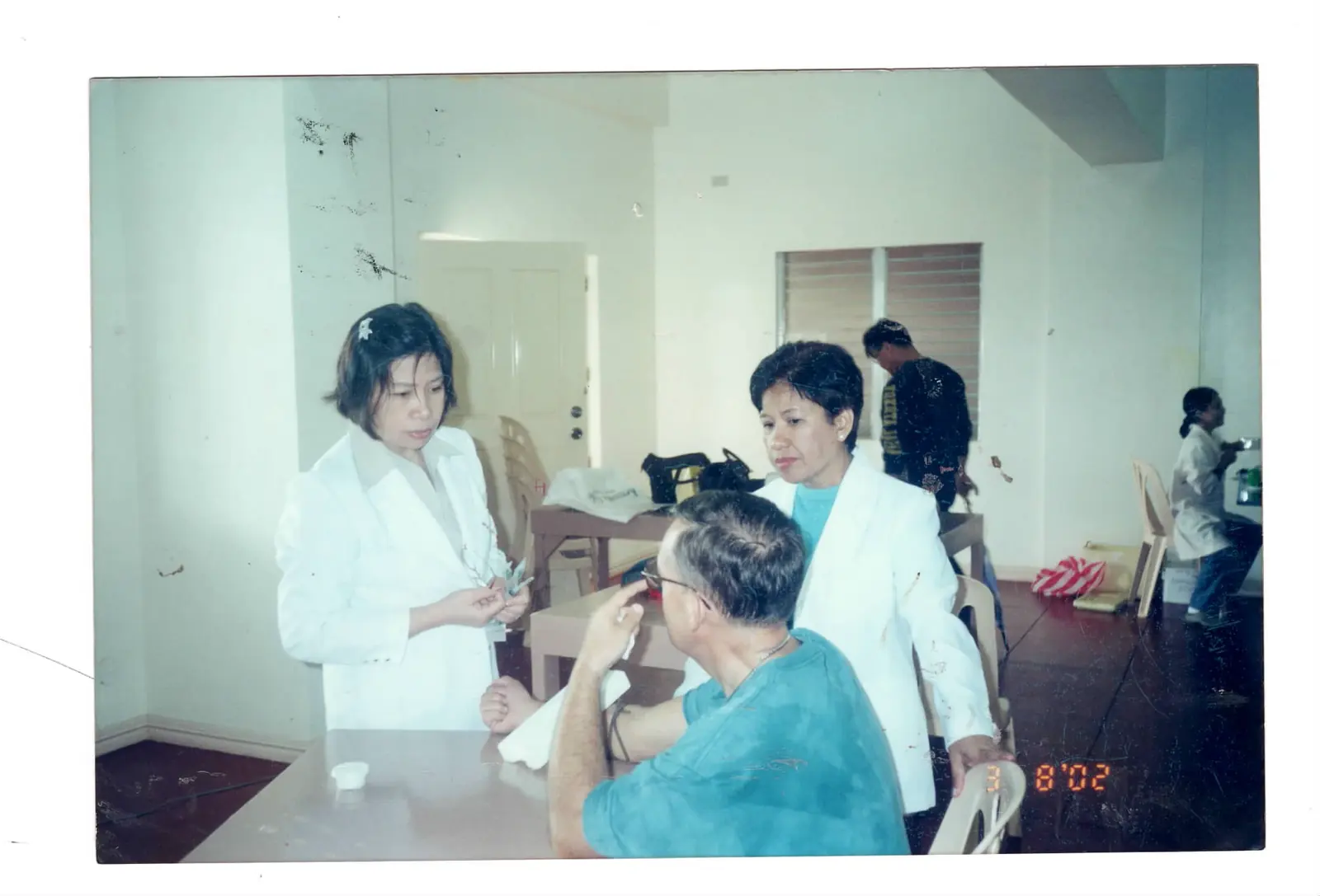 Sacred Heart healthcare professionals serving a patient during an outreach mission
