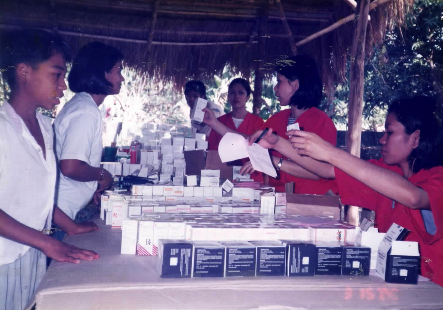 Sacred Heart mission team organizing medicines and medical supplies for community distribution